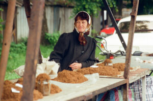 Ukranian lady selling fine cut tobacco at Zabolotiv Market, Ukraine