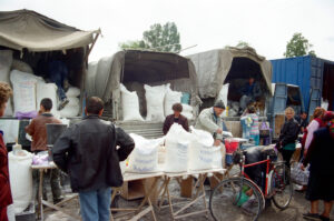 Selling RIVNE-BOROSHNO flour at Zabolotiv Market, Ukraine