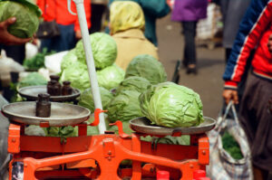 Close-up of cabbage on orange scales at Zabolotiv Market, Ukraine