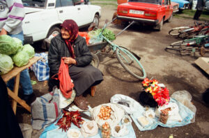 Baboushka selling vegetables at Zabolotiv Market, Ukraine