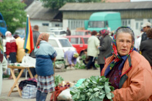 Farmer&#039;s wife selling vegetables at Zabolotiv Market, Ukraine