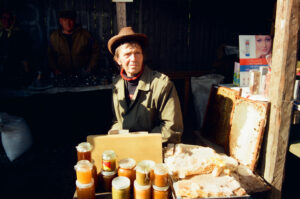 Beekeeper and his goods at Kosiv Market - Ukraine