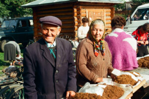 Farmer and his wife selling fine-cut tobacco at Zabolotiv Market, Ukraine