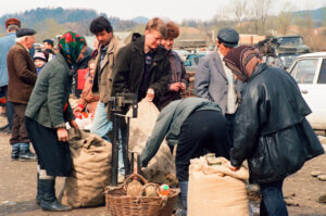 Farmer selling potatoes at Kosiv Market - Ukraine