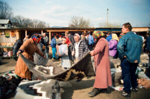 Customers selecting Hutsul wool rag at Kosiv Market - Ukraine
