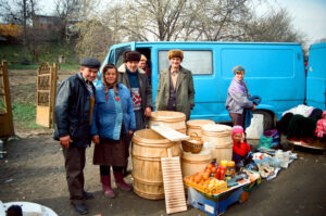 Cheerful merchants with barrels at Kosiv Market- Ukraine